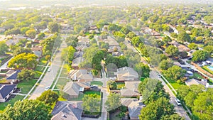 Bird eye view clean and peaceful neighborhood streets with row of single family homes near Dallas, Texas, USA