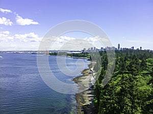 Bird eye view from Lion bridge over Stanley park.  vancouver city background. beauty beach near green forest in natural park and b