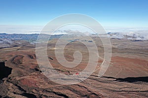 A bird eye view of the refugee of the Chimborazo, a vulcano in Ecuador, South America surrounded by plains