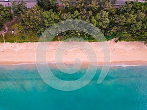 Bird eye view seashore with wave crashing on sandy shore. Beautiful waves sea surface in sunny day summer background, Amazing