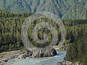 Bird-eye view of swift river in the forest