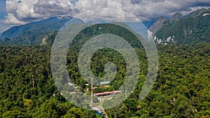 Bird-eye view of village Mulu surrounded by forest and mountains near Gunung Mulu national park. Borneo. Sarawak.