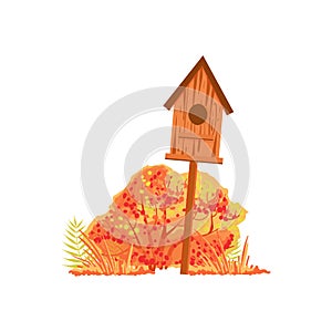 Bird House And Bush With Orange Leaves As Autumn Attribute