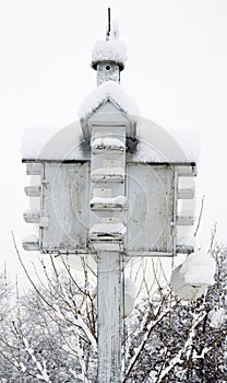 Bird House Covered in Snow