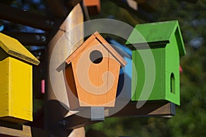 Bird houses. Colored birdhouses on the street.