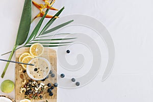 bird paradise flower with healthy smoothies with dryfruits white background. High quality photo