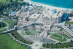 Bird`s eye and aerial drone view of Emirates Palace in Abu Dhabi city from observation deck