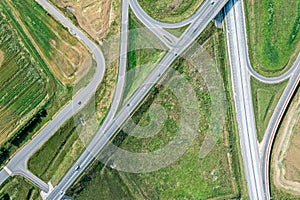 Bird`s eye top view photo of road junction in rural landscape