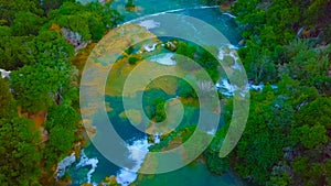 Bird`s Eye View of Croatia, Europe ; Last sunlight lights up the pure water waterfall on Plitvice National Park. Colorful spring