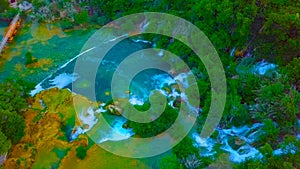 Bird`s Eye View of Croatia, Europe ; Last sunlight lights up the pure water waterfall on Plitvice National Park. Colorful spring