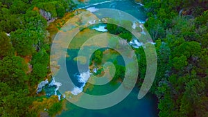 Bird`s Eye View of Croatia, Europe ; Last sunlight lights up the pure water waterfall on Plitvice National Park. Colorful spring