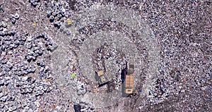 Bird`s eye view of a garbage dump where machinery equals mountains of household waste, Ukraine. Ecological problem