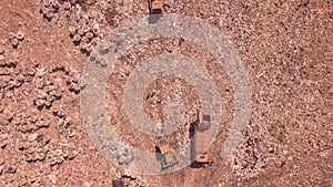 Bird`s eye view of a garbage dump where machinery equals mountains of household waste, Ukraine. Ecological problem