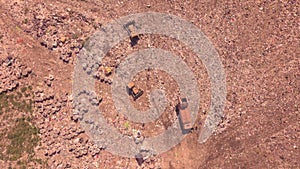 Bird`s eye view of a garbage dump where machinery equals mountains of household waste, Ukraine. Ecological problem