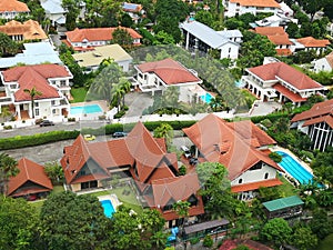 Bird's eye view of high class landed property estate with large beautiful houses and many private swimming pools