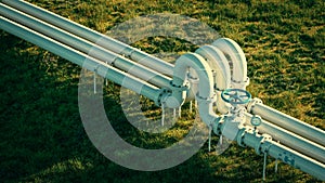 A bird\'s eye view of a hydrogen gas pipeline located in a meadow.
