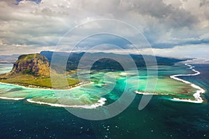 A bird`s-eye view of Le Morne Brabant, a UNESCO world heritage site.Coral reef of the island of Mauritius.Storm cloud