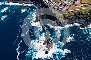 Bird`s eye view of the ocean surf on the reefs coast of San Miguel island, Azores. photo