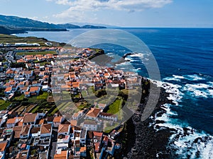 Bird`s eye view of the ocean surf on the reefs coast of San Miguel island, Azores. photo