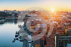 Bird`s-eye view of old downtown of Porto - Douro river and Ribeira from Dom Luis I bridge at amazing sunset.