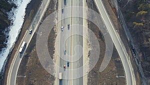 Bird's-eye view of the roundabout, cars driving along the road.