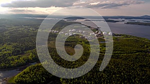 Bird`s-eye view of the Russian tank farm on the White Sea. The span of the drone over the taiga to the tank farm.