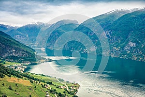 Bird`s-eye view of Sognefjorden fjord. Colorful summer scene with Aurlandsvangen village, Norway. Traveling concept background.