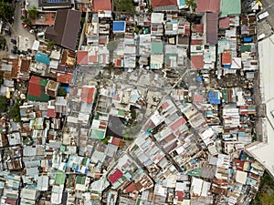 Bird`s Eye view of a squatter area with narrow passageways and corrugated metal roofs in Metro Manila