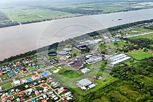 Bird`s-eye view of the suburbs of Georgetown and the river Demerara, rum factory