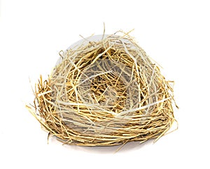 bird\'s nest or hen house made from dry straw golden color. Isolated on white background