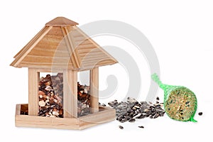Bird seed in a bird box with a fat ball