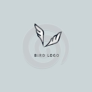 Bird silhouette logo. Vector abstract minimalistic illustration flying fowl. Pigeon icon. Zoo, pet shop, farm, bird feather, wild photo