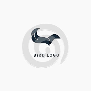 Bird silhouette logo. Vector abstract minimalistic illustration flying fowl. Pigeon icon. Zoo, pet shop, farm, bird feather, wild photo