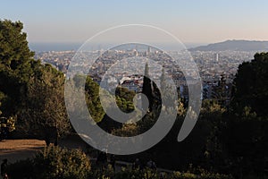 Bird view panorama of cityscape of Barcelona, capital of Catalonia, Spain from Park Guell before sunset with blue sky