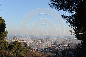 Bird view panorama of cityscape of Barcelona, capital of Catalonia, Spain from Park Guell before sunset with blue sky