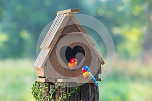 Birdhouse have a heart-shaped entrance and two love bird made fr