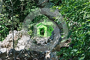 Birdhouse on an island inside a lake