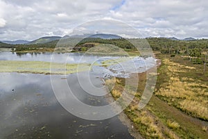 Birdlife And Clouds On A Dam