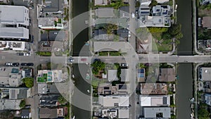 Birds eye shot of dense town development in Venice Canals area. Luxury family houses in residential urban neighborhood