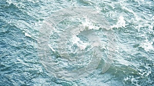 birds-eye view of the abstract and powerful water currents, rapids and whirlpools