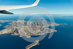 Birds-eye view of Greek Kalymnos island of Dodecanese archipelago and Aegean sea from plane window