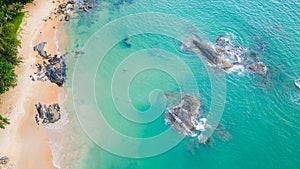 Birds-eye view of a sandy tropical beach and warm ocean (Khao Lak, Thailand