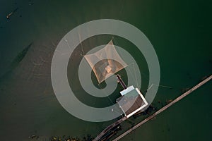 Birds view of fishing hut on river photo