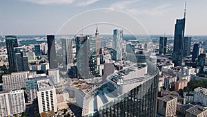 Birdseye view of modern apartment buildings and skyscrapers with Palace of Culture and Science in the background. Warsaw