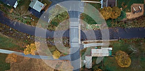 Birdseye view of road crossing stream in Vermont