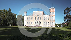 Birinu Palace, Latvian Castle by Lake With Nice Garden. Birini Manor, Vidzeme Region, Latvia. Stedicam Shot Autumn Sunny Day