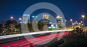 Birmingham alabama city skyline and highway traffic trails