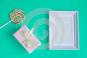 Birth of child - blank picture frame on turquoise background