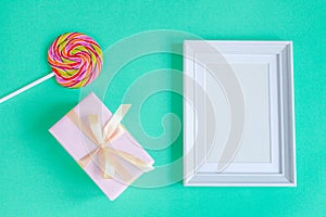 Birth of child - blank picture frame on turquoise background