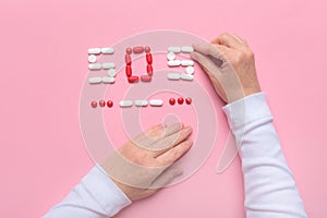 Birth control concept with pills spelling SOS in Morse code